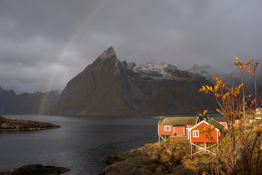 Rainbow over Hamnoy fishing village on autumn day in Lofoten island, Nordland, Norway
