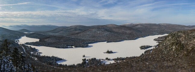 Panoramic of a winter morning seen from La Roche look point overlooking Lac Monroe at Mont-Tremblant National Park in Quebec, Canada.