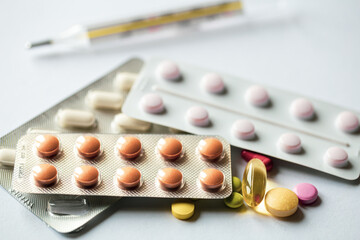 Close-up, assorted pills on a white background.