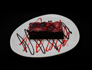 delicious cake slice: Cake slice in plate with black background.