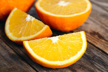 Fototapeta na wymiar Close-up, slices of orange on a wooden background.