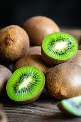 Ripe fruits of kiwi cut and whole, close -up.