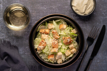Macro food photography of caesar salad, chicken, iceberg, lettuce, parmesan, croutons, sauce