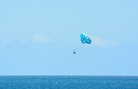 Parasailing above Caribbean sea.  Summer holiday activity. Space for copy. 
