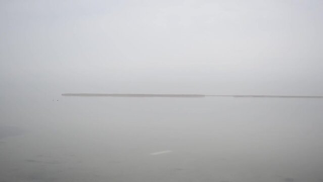 Ice on the sea, fog. The sea in fog.