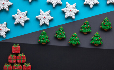 Christmas gingerbread covered with icing on a colored background, flat lay.