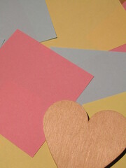 colorful post it with wooden heart shape