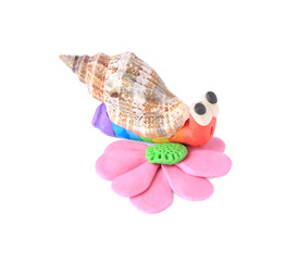 Beautiful plasticine snail with flower on white background. Children's handmade ideas