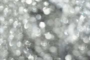 White, silver glitter vintage lights background defocused for festivals and celebrations, abstract...