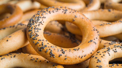 Many delicious ring shaped Sushki (dry bagels) as background, closeup