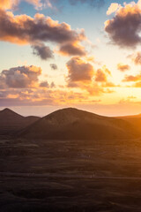 Amazing sunset over El Cuervo Volcano, in Lanzarote, Canary Islands,  Spain