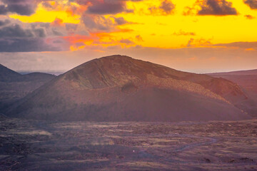 Amazing sunset over El Cuervo Volcano, in Lanzarote, Canary Islands,  Spain