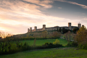 Fototapeta na wymiar Sunset over the medieval fortified town of Monteriggioni, Tuscany, Italy