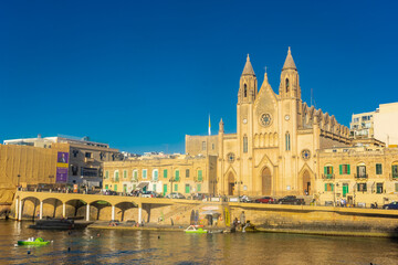 Fototapeta premium Sliema, Malta, 22 May 2022: The Cathedral right on the harbor of Sliema
