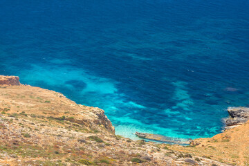 Crystal clear turquoise water down the Dingli Cliffs,  Malta