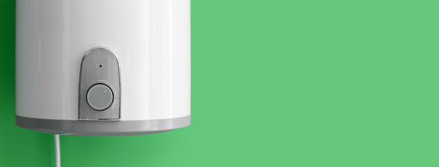 Modern electric boiler on green background with space for text