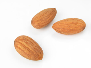 Three almonds on white
