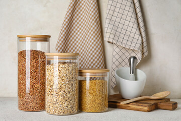 Jars with cereals on light table