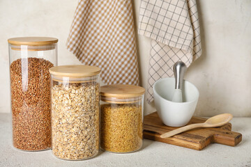 Jars with cereals on light table