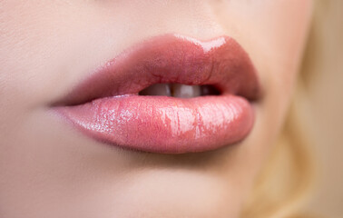 Female mouth with sexy pink lips isolated closeup. Close up woman sensual lips with red lipstick. Passionate lip.
