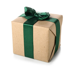 Gift box tied with green ribbon on white background