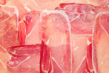 Slices of ham as background, closeup