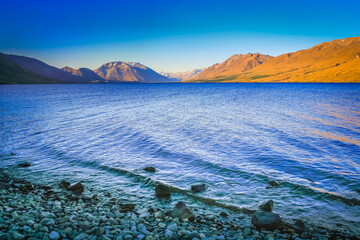 Lake Tekapo at peaceful evening, New Zealand South island idyllic landscape