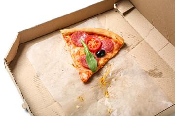 Cardboard box with piece of tasty pizza on white background, closeup