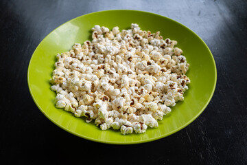 Popcorn is a type of confectionary made from corn kernels that are heated until they explode