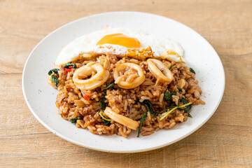 fried rice with squid and basil topped fried egg in Thai style