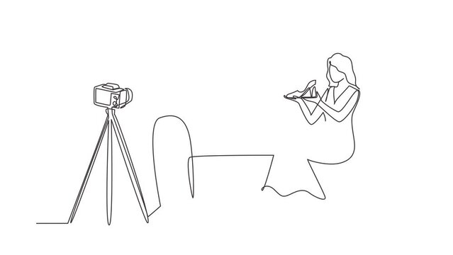 Animated self drawing of continuous line draw stylish blogger is sitting at sofa, reviewing heels shoe in her hands while recording video with digital camera, tripod. Full length one line animation