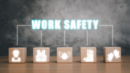 Work safety concept, Wooden cube block on desk with work safety icon with copy space.
