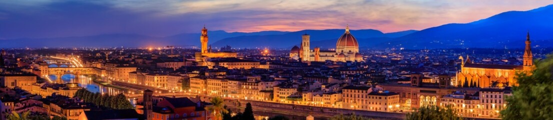 Fototapeta na wymiar Panorama of Duomo Santa Maria del Fiore cathedral, Bell Tower of Giotto and Palazzo Vecchio Tower in Florence, Italy in a colorful sunset, aerial view