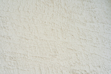 Gray uneven cement wall with trowel marks. Design solutions in the loft interior and repair. Space for text. Background. Rough surface from uneven cement wall.