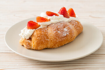 strawberry fresh cream croissant on plate