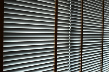 white blinds curtain put on the window, interior design