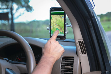 tourist using an application on mobile phone, to help give navigator directions. to travel and technology concept.