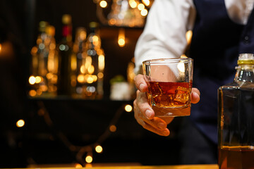 Bartender pouring Whiskey, on  bar