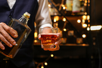 Bartender pouring Whiskey, on  bar,