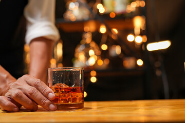 Bartender pouring Whiskey, on  bar,