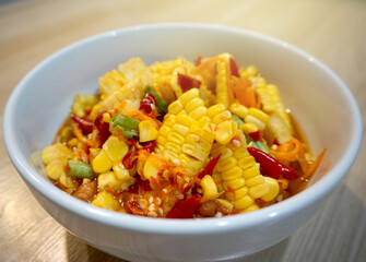 Corn spicy salad thai food on the wood table.
