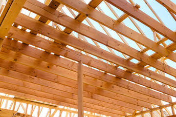 Construction of new house. View of the wooden roof structure.