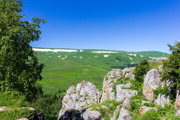 Summer, mountainous terrain, hiking trails running through the park, a place for walking and...