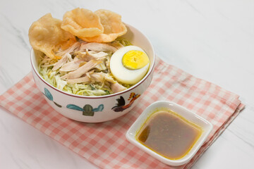 Chicken Soto with chili sauce or Soto Ayam in Indonesia. Soto ayam is a traditional Indonesian food