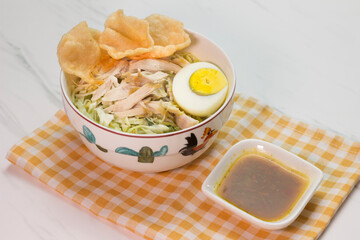 Chicken Soto with chili sauce or Soto Ayam in Indonesia. Soto ayam is a traditional Indonesian food
