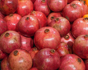 fresh pomegranate in pile as food background