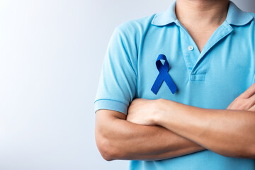 March Colorectal Cancer Awareness month, Woman holding dark Blue Ribbon for supporting people...