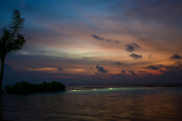 Beautiful Tropical sunset landscape in Maldives island Baa , with infinity Indian ocean sea water...
