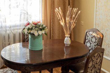 Composition with a bouquet of fresh cut flowers, selective focus.