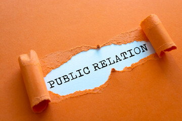 Public Relation written under torn paper.